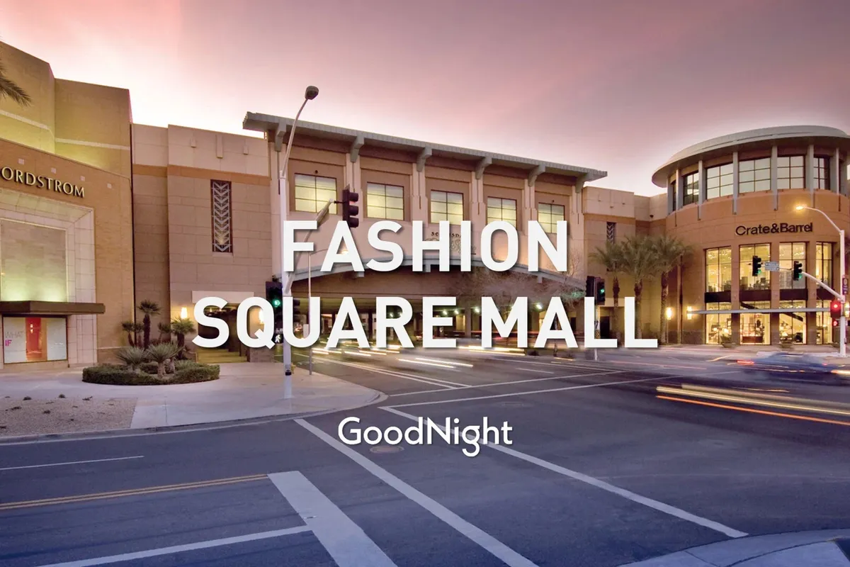 This exterior shot features a lively shopping and dining district with recognizable stores, palm trees, and visible traffic lights, capturing the energetic vibe of Scottsdale’s urban scene. The image conveys the ease of access to shops, restaurants, and cafes—key points in the section narrative.