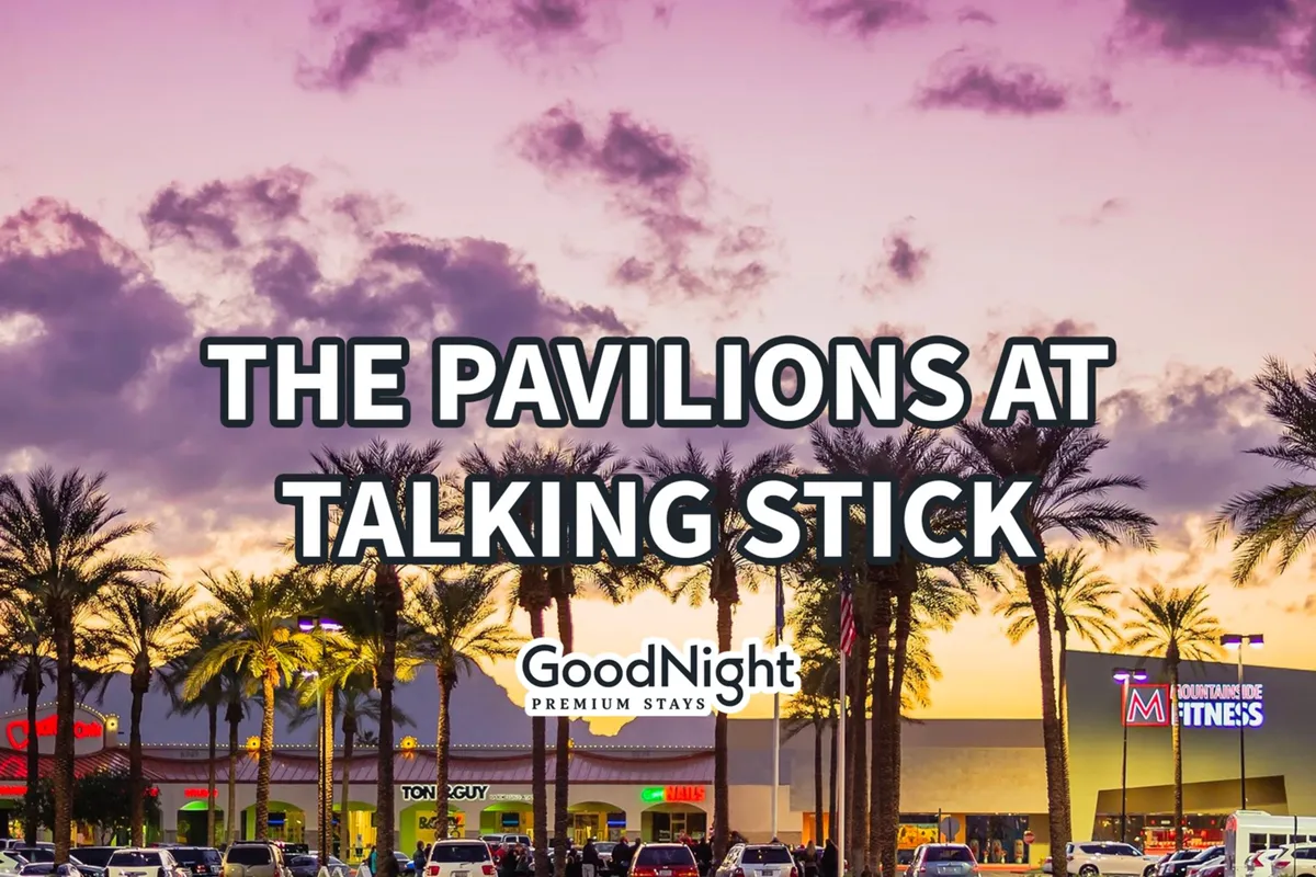 This photo highlights a palm-lined shopping center with visible brand signage, inviting foot traffic, and a warm, sunset glow that enhances the relaxed, vibrant mood of an outdoor retail and dining destination.