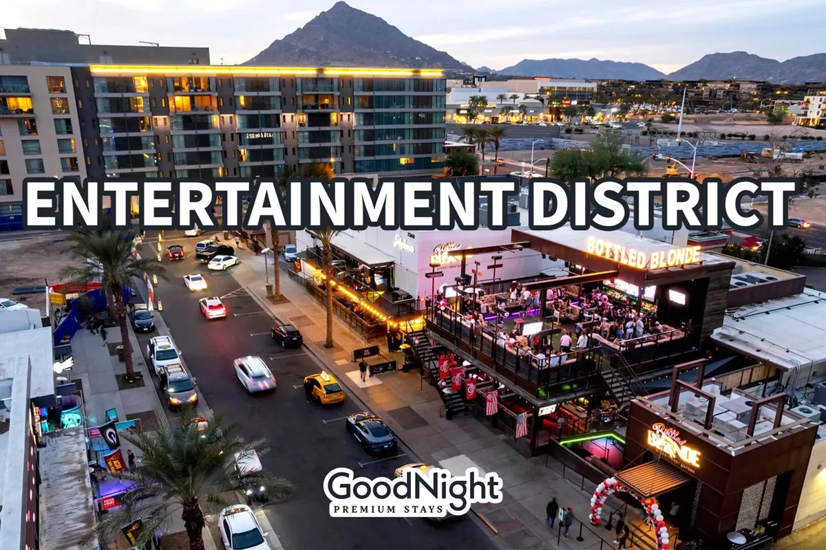 The image features a bustling urban street scene with entertainment venues, traffic, and a distant mountain backdrop. The lively atmosphere suggests nightlife, dining, and social activities in a vibrant city environment.